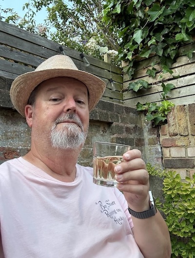 Rob Beattie toasting with a glass of wine